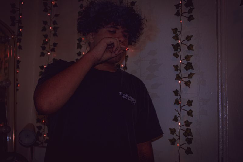 Curly hair, by the ivy. Photograph by Isaiah Sanchez.