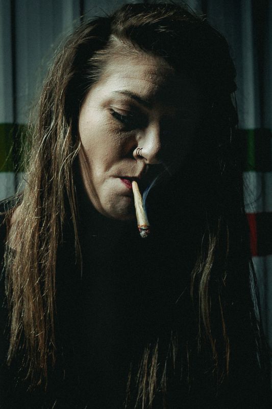 A cigarette in the dark — from Graveyard Shift. Photograph by Isaiah Sanchez.