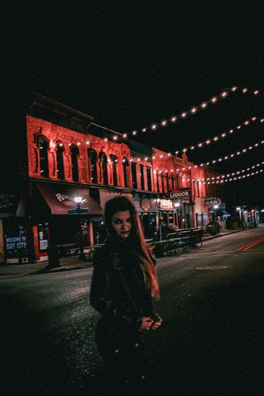 A figure, red light. Photograph by Isaiah Sanchez.