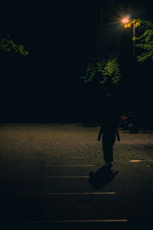 A lone figure on the lot — from Graveyard Shift. Photograph by Isaiah Sanchez.