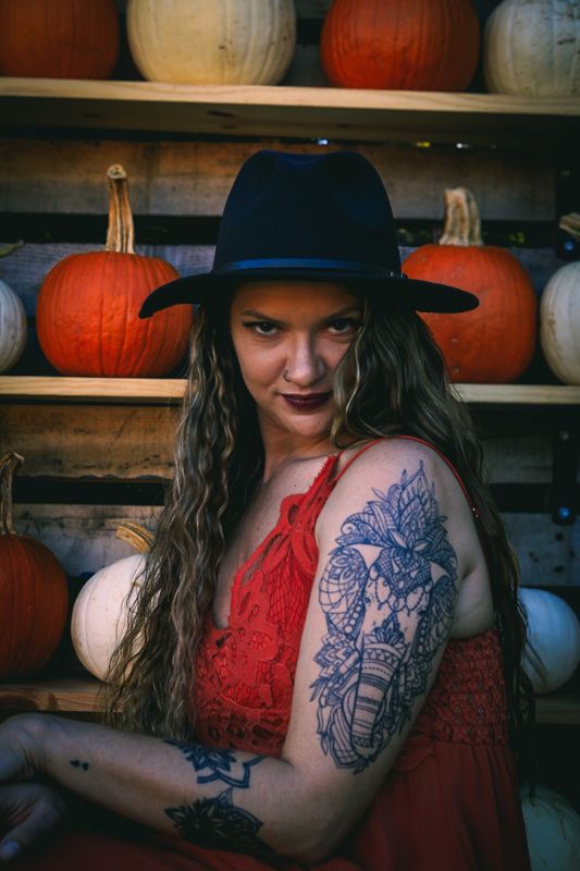 Red dress, pumpkins. Photograph by Isaiah Sanchez.