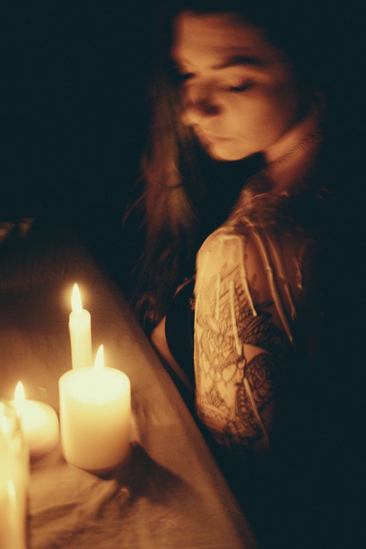 Profile, ringed by light — from By Candlelight. Photograph by Isaiah Sanchez.