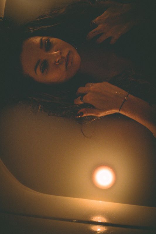Lying beside the candle — from By Candlelight. Photograph by Isaiah Sanchez.